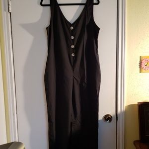 Jumpsuit Black silky like material.  Button up fro